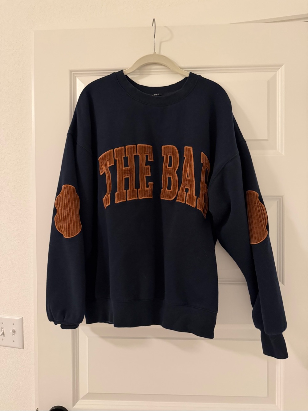The Bar Navy Crewneck Sweater with Brown Appliqué